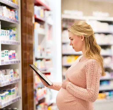 pregnant-woman-with-tablet-pc-at-pharmacy-2021-08-26-22-49-05-utc (1)